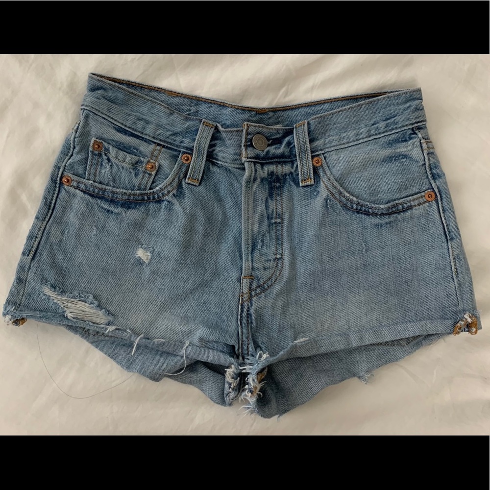 Levi’s 501 light wash denim distressed shorts
